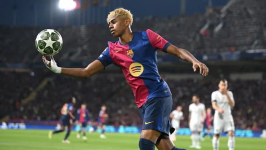 Lamine Yamal, Barcelona's number 10, dribbling past a defender in the 2025/26 home kit. The young forward shows his world-class ball control and agility during a La Liga match at the Spotify Camp Nou.