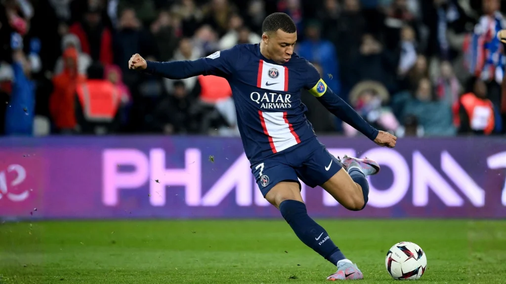 Kylian Mbappé celebrating a goal for Real Madrid at the Santiago Bernabéu.